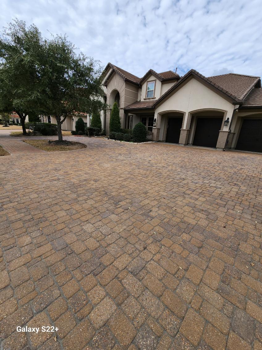 Paver driveway installation by By The Brick