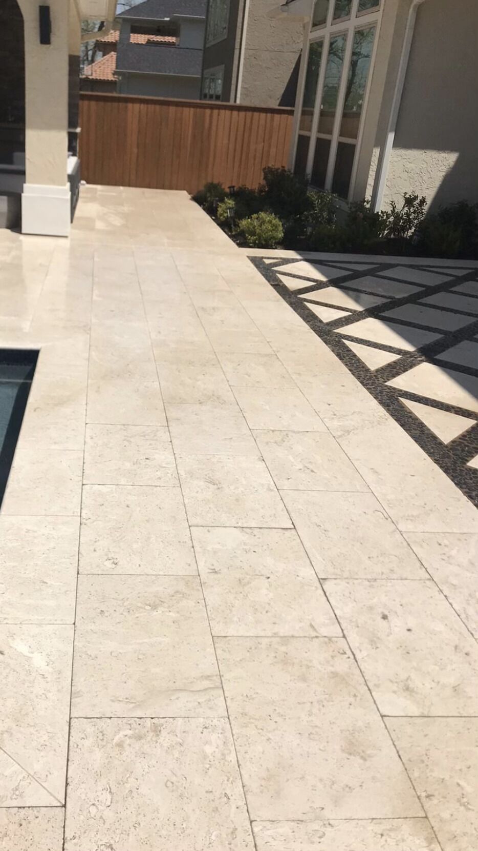 Retaining wall and paver patio by By The Brick